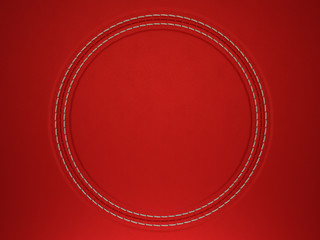 Red stitched circle shape on leather background