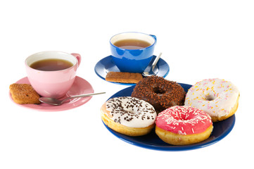 Cups of tea with donuts