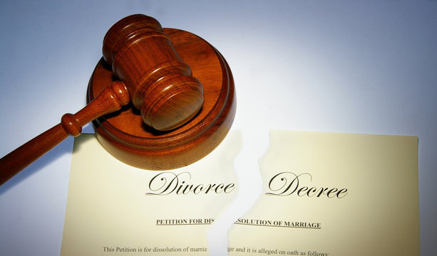 divorce decree ripped in two, and legal gavel