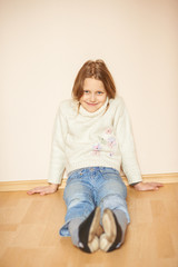 Portrait of a smiling little girl, indoors