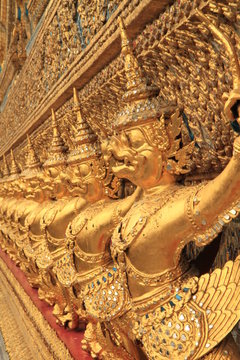 The Grand Palace in Bangkok. Gold ornamental patter statuettes.