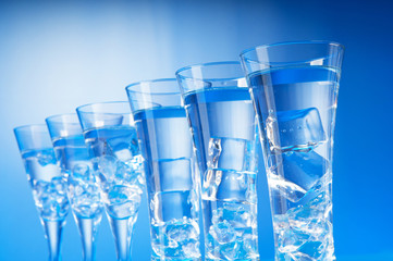 Water in the glass against gradient background