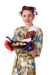 Young housewife with cookies in frying pan