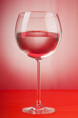 Water in the glass against gradient background