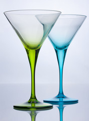 Green and blue empty cocktail glasses