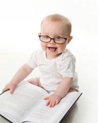 Baby reading with glasses