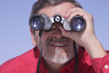 Man searching with Binoculars bird watcher