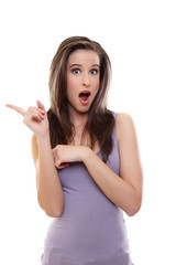 Fototapeta premium surprised brunette woman show something