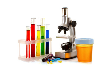 Laboratory metal microscope and test tubes with liquid isolated