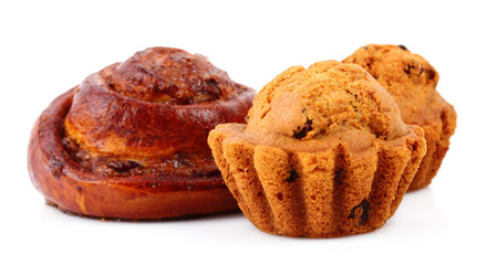 Loaf with raisins and muffin isolated on white