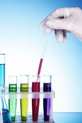 Test tubes over blue background