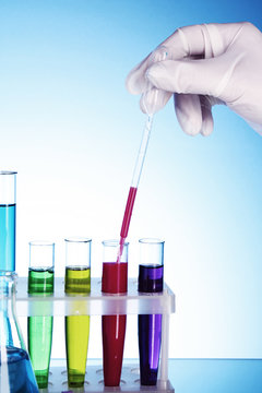 Test tubes over blue background