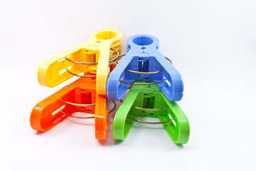Fototapeta premium Colorful clothes pegs isolated on white background