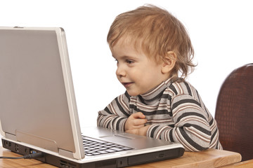 Little child and laptop.