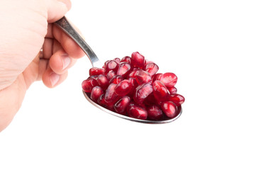 pomegranate seeds on the spoon