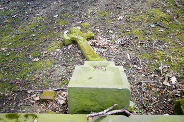 Fallen cross on the cemetery