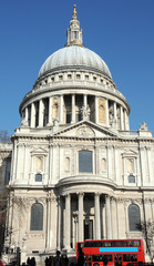 Fototapeta na wymiar Red London bus and Christopher Wrens St Pauls Cathedral