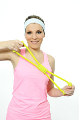 athletic woman doing gymnastic exercises with an elastic fitness