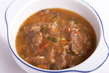 Meat stew with vegetables and herbs