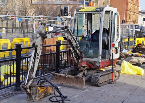 Excavator/digger at work in the city 