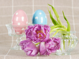 easter decoration. spring flowers with ceramic eggs