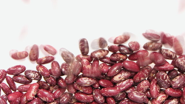Falling beans on white background.