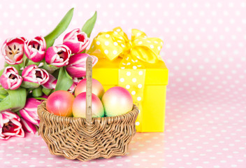 Fototapeta na wymiar Pink tulips, easter eggc and gift box