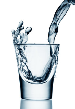 Water/vodka being poured into a glass