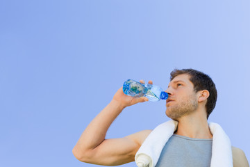 Man drinking water after the gym