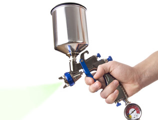 Hand and spray gun at work