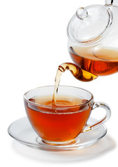 Tea being poured into glass tea cup