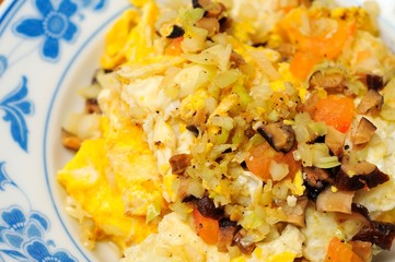 Freshly cooked egg with vegetable topping