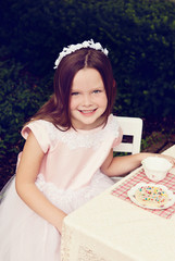 Little Girl Having Tea Party