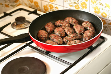 Meat balls cooking in frying pan