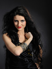 Beautiful woman with long black healthy hair in arabic tradition