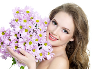Happy woman with spring purple flowers