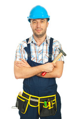 Smiling mid adult workman with hammer