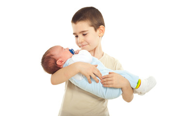 Boy holding his newborn brother