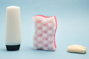 White blank cosmetics bottle with bath sponge and soap