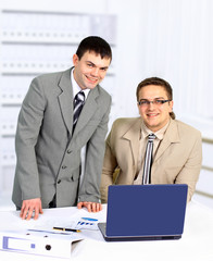 Two handsome businessmen working together on a