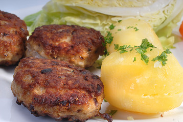 closeup of frikadelles and potatoes