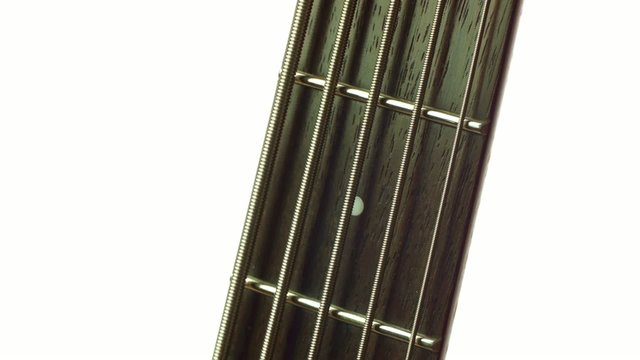 detail of electric bass, pickups and cords