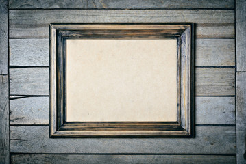 Vintage wooden frame with an empty cardboard