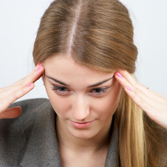 Beautiful businesswoman trying to focus on work