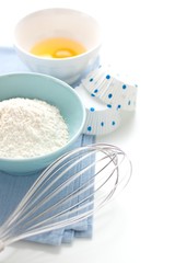 Flour, eggs and whisk