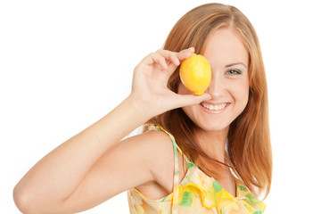 Young woman holding lemon