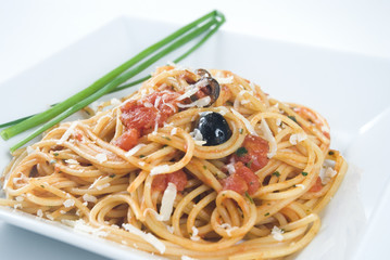 Spaghetti Puttanesca,a traditional italian recipe.