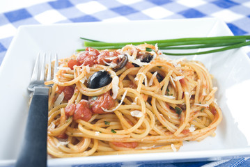 Spaghetti Puttanesca,a traditional italian recipe.