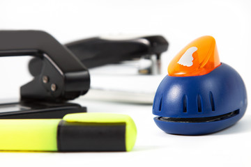 office hole punch and staplers isolated in white
