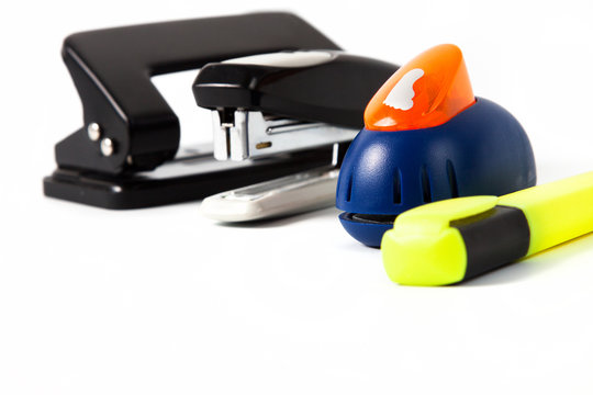 office hole punch and staplers isolated in white